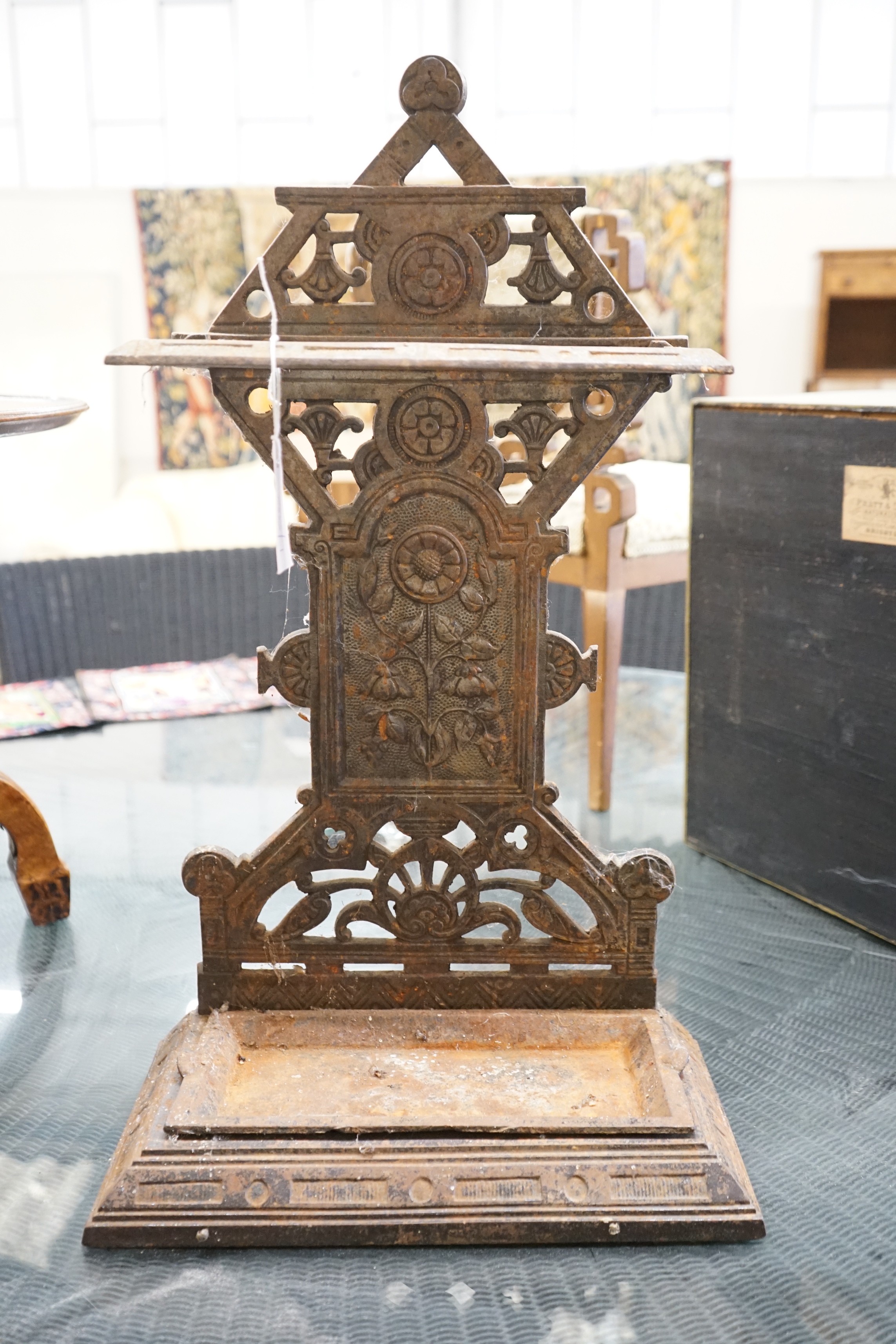 A late Victorian aesthetic movement cast-iron stickstand, width 40cm, depth 22cm, height 69cm